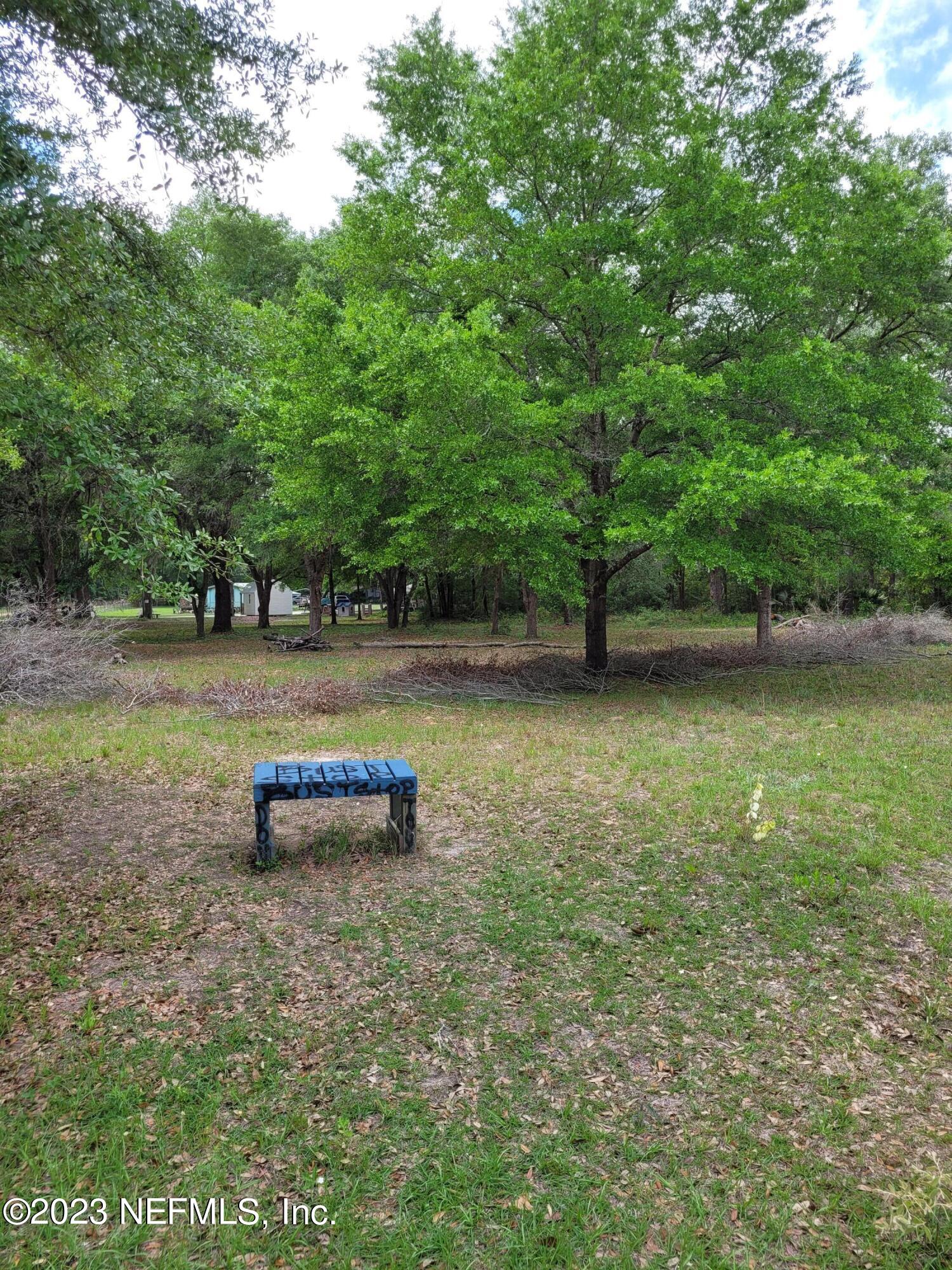 Lot 10 Magnolia Road Hawthorne, FL 32640 - Photo 4 of 7 a view of a lake with outdoor space