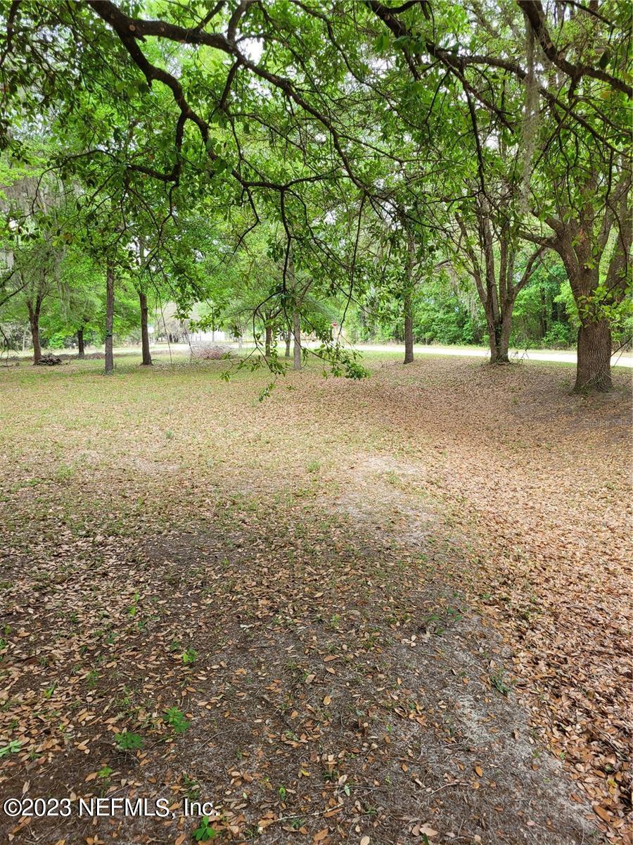 Lot 10 Magnolia Road Hawthorne, FL 32640 - Photo 6 of 7 a view of outdoor space with deck and tree
