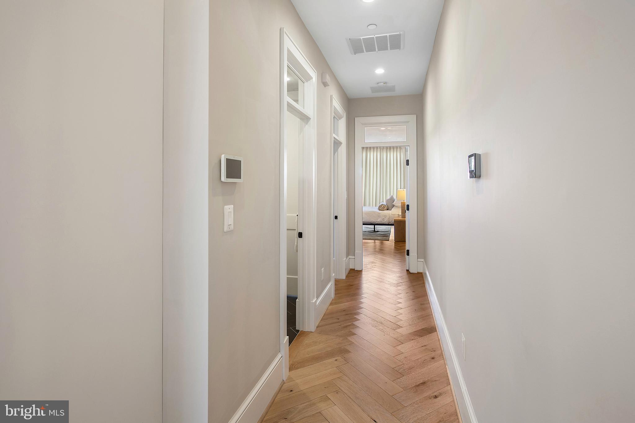 2139 N Street Northwest, Unit 4 Washington, DC 20037 - Photo 15 of 28 a view of a hallway with wooden floor