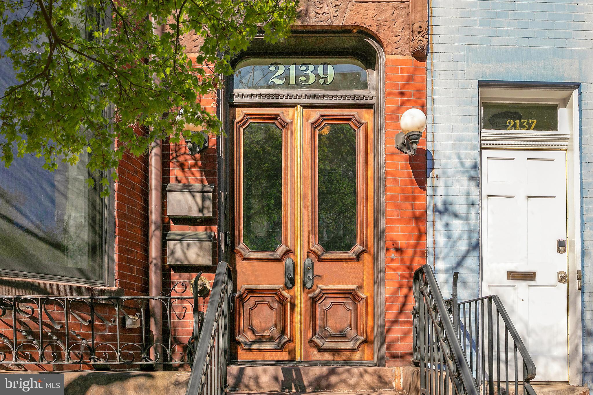 2139 N Street Northwest, Unit 4 Washington, DC 20037 - Photo 2 of 28 a view of a brick house with large windows