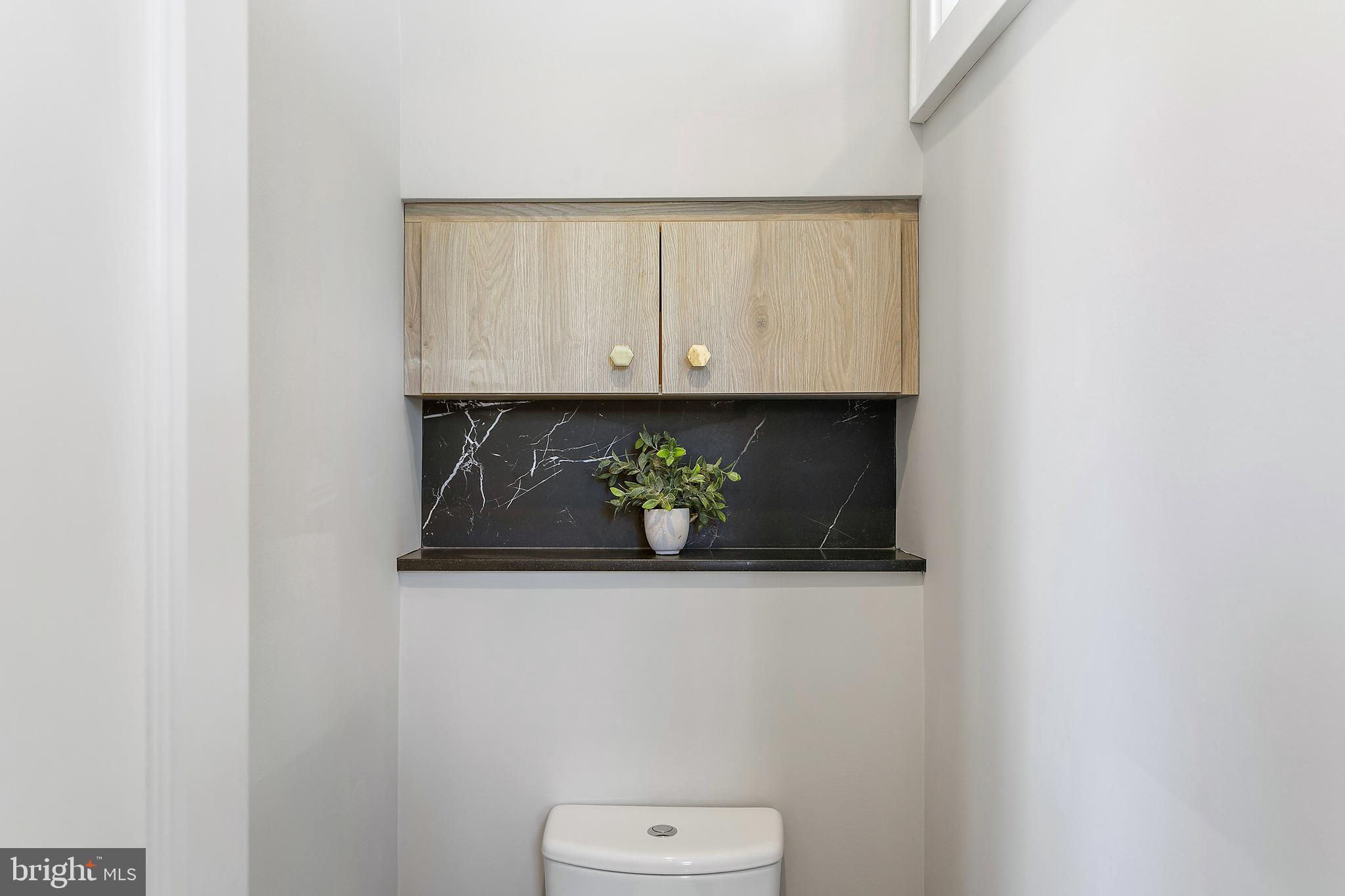 2139 N Street Northwest, Unit 4 Washington, DC 20037 - Photo 20 of 28 a bathroom with a sink and a toilet
