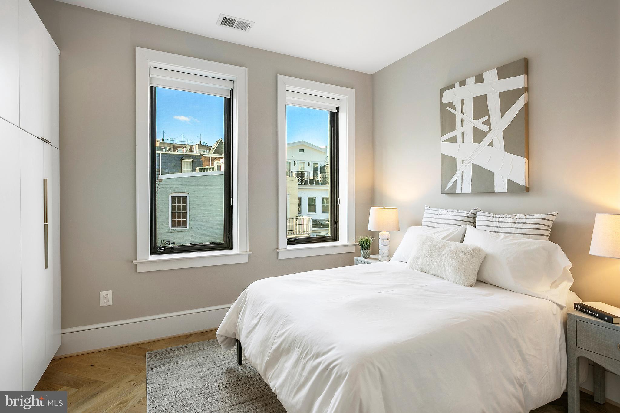 2139 N Street Northwest, Unit 4 Washington, DC 20037 - Photo 21 of 28 a bedroom with a bed and a window