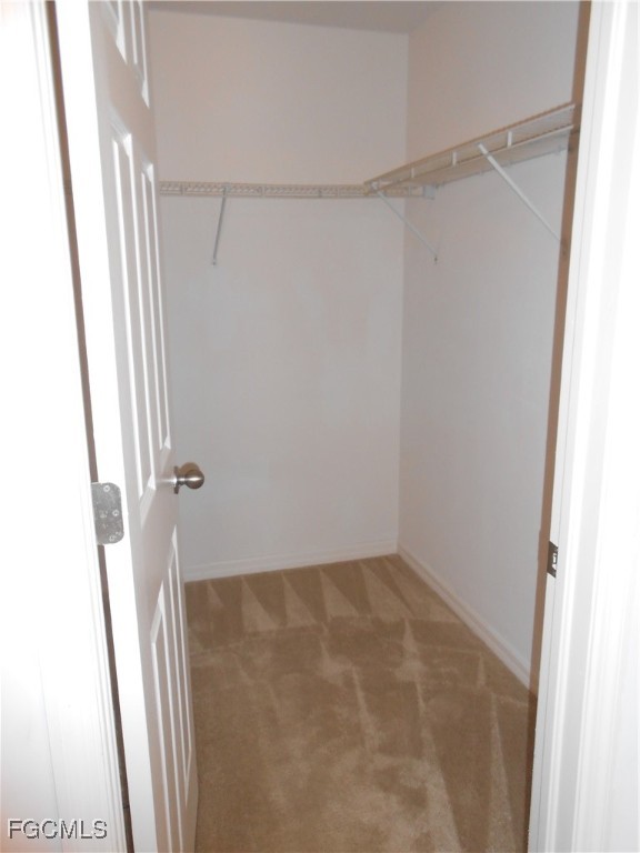 154 Shadowview Court Lehigh Acres, FL 33974 - Photo 22 of 40 a view of closet area