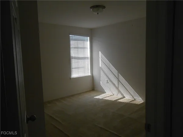 a view of an empty room and window