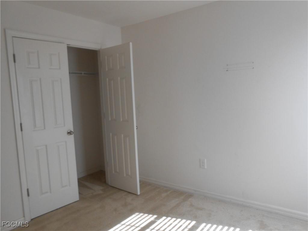 154 Shadowview Court Lehigh Acres, FL 33974 - Photo 31 of 40 a view of an empty room
