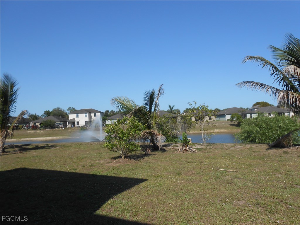 154 Shadowview Court Lehigh Acres, FL 33974 - Photo 37 of 40 a view of lake view and mountain view