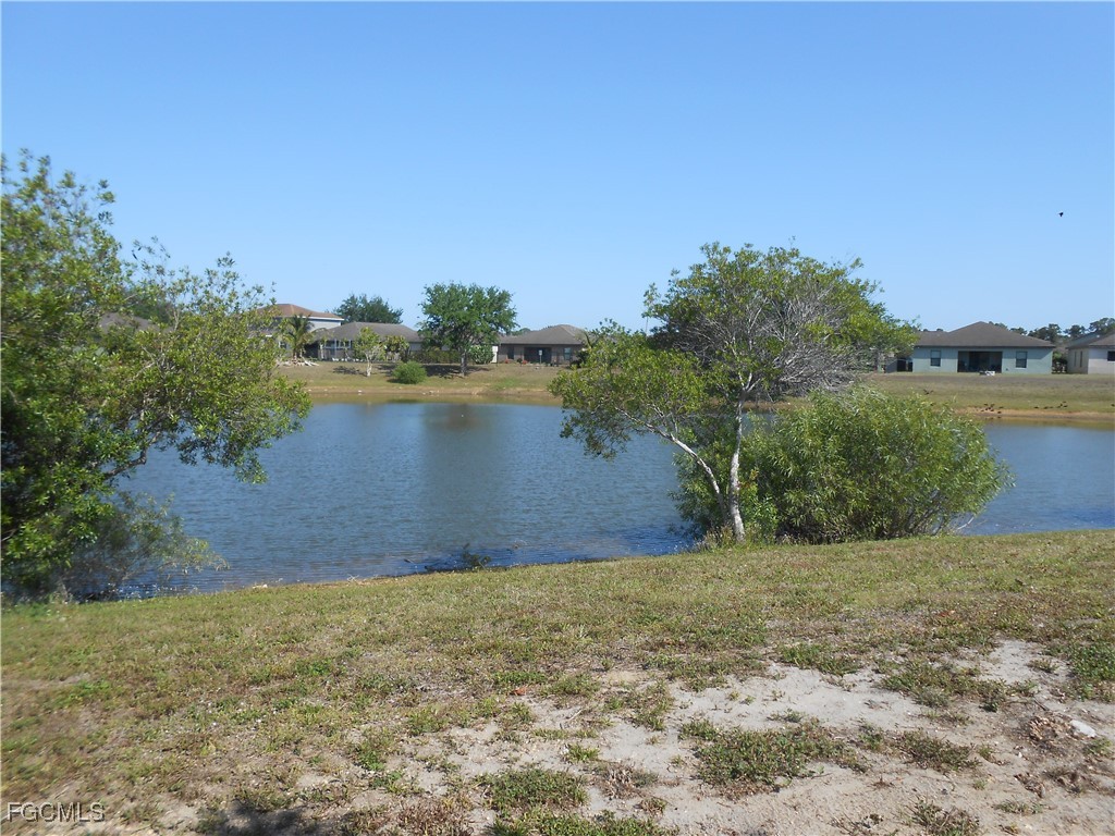 154 Shadowview Court Lehigh Acres, FL 33974 - Photo 38 of 40 a view of lake view and mountain view
