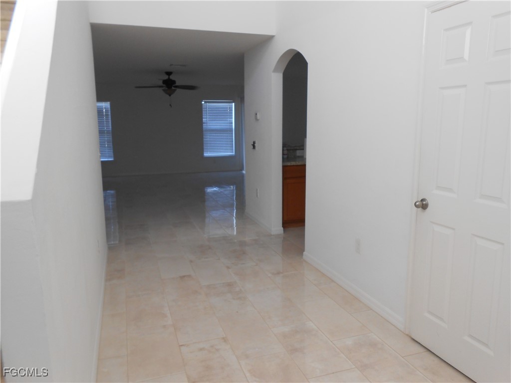 154 Shadowview Court Lehigh Acres, FL 33974 - Photo 4 of 40 an empty room with windows