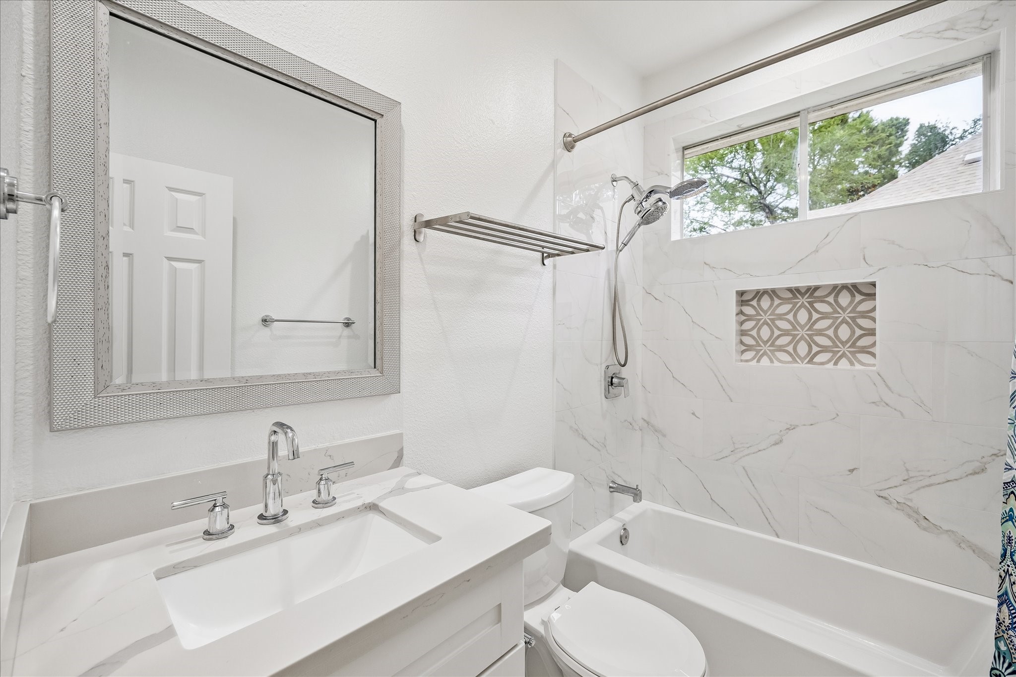 15 West Beckonvale Circle The Woodlands, TX 77382 - Photo 22 of 44 The full bathroom is wonderfully updated and services the casita. The window allows for sunlight to beam in.