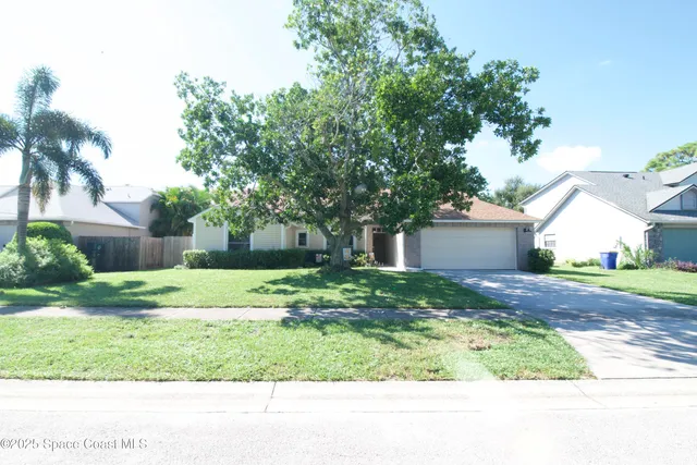 a view of a yard with a house and garden