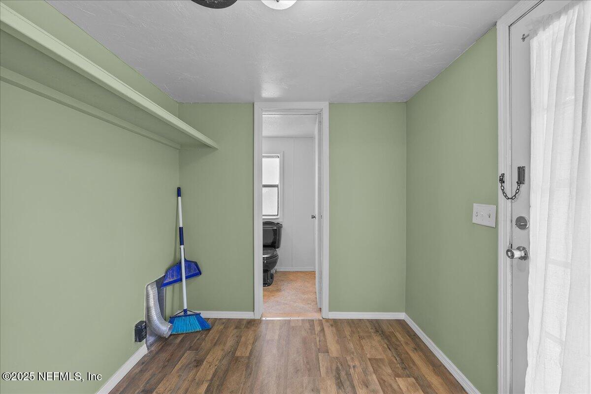 301 Kitty Avenue Interlachen, FL 32148 - Photo 14 of 23 a view of hallway with wooden floor