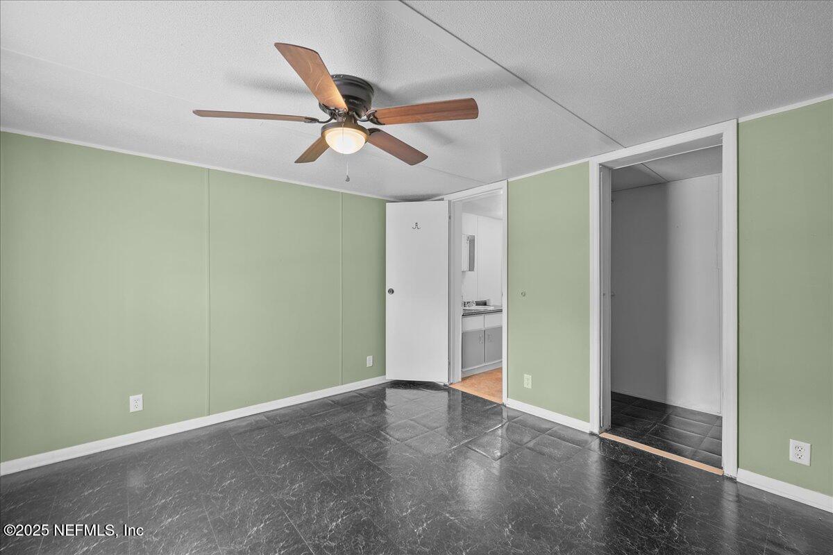 301 Kitty Avenue Interlachen, FL 32148 - Photo 18 of 23 a view of a room with a ceiling fan