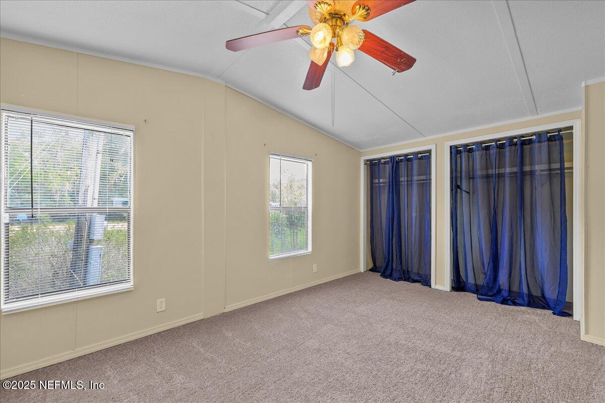 301 Kitty Avenue Interlachen, FL 32148 - Photo 19 of 23 a view of an empty room with a window