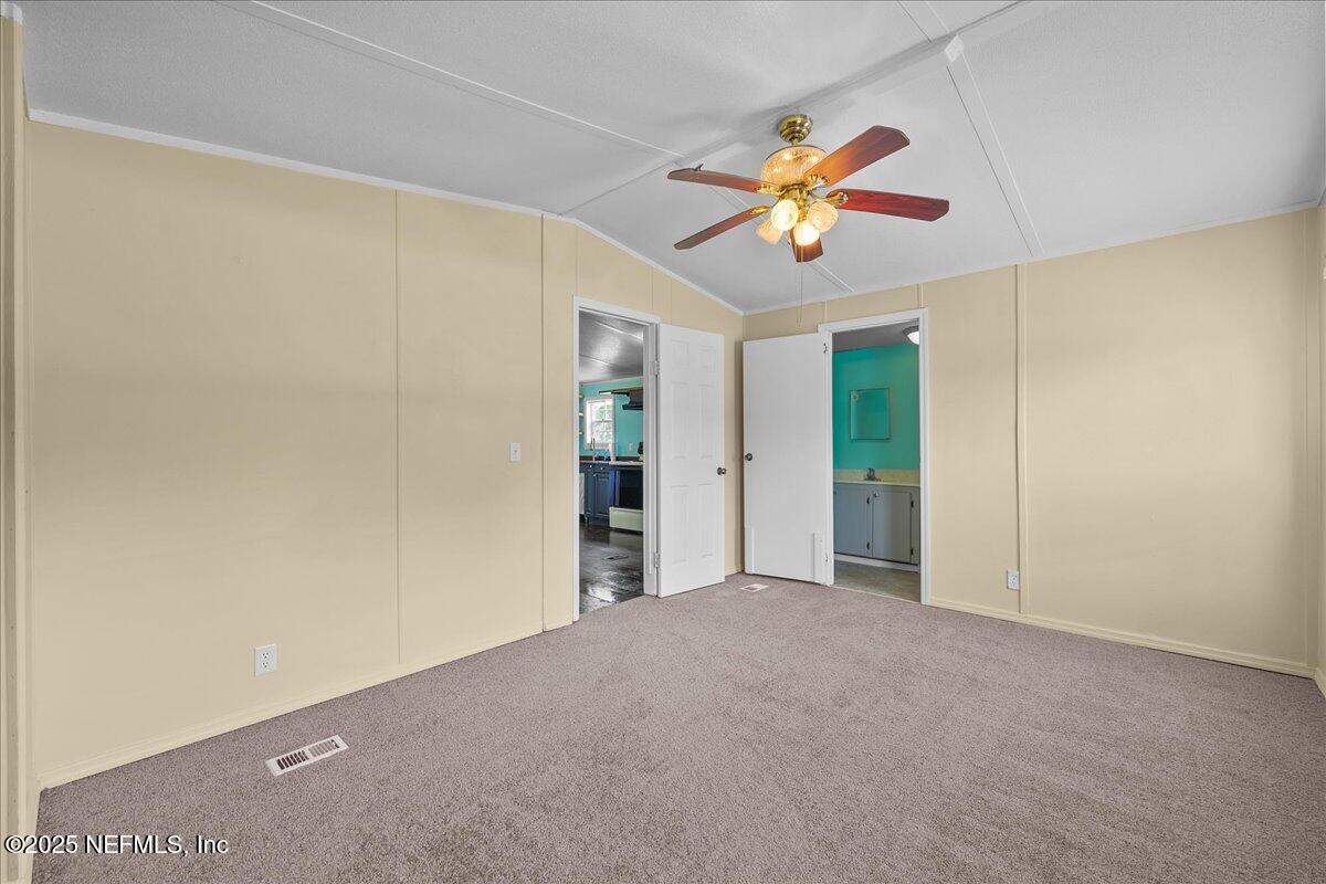 301 Kitty Avenue Interlachen, FL 32148 - Photo 21 of 23 a view of an empty room with a window