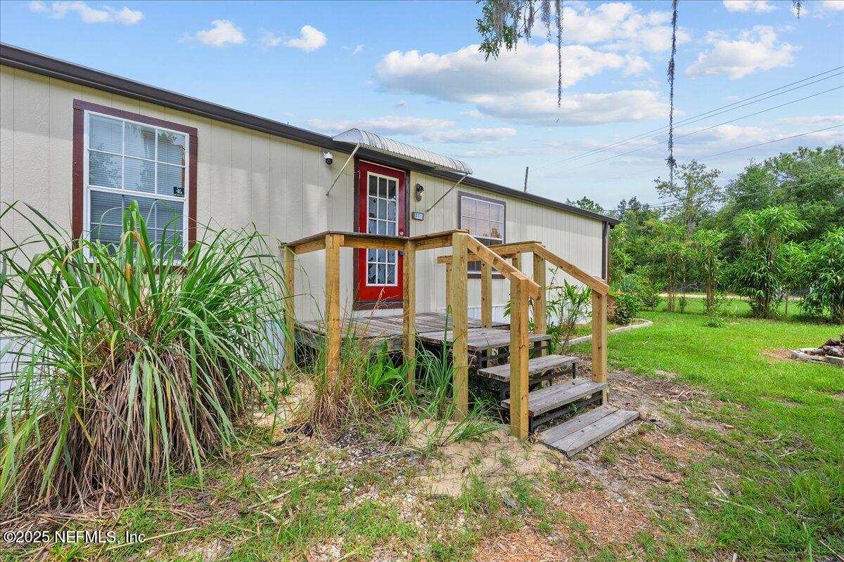 301 Kitty Avenue Interlachen, FL 32148 - Photo 6 of 23 a sign on the side of a road