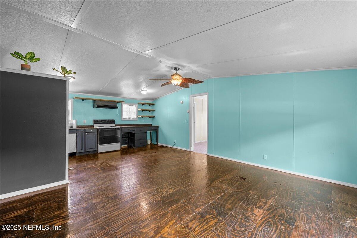 301 Kitty Avenue Interlachen, FL 32148 - Photo 8 of 23 a view of a livingroom with furniture and an empty room