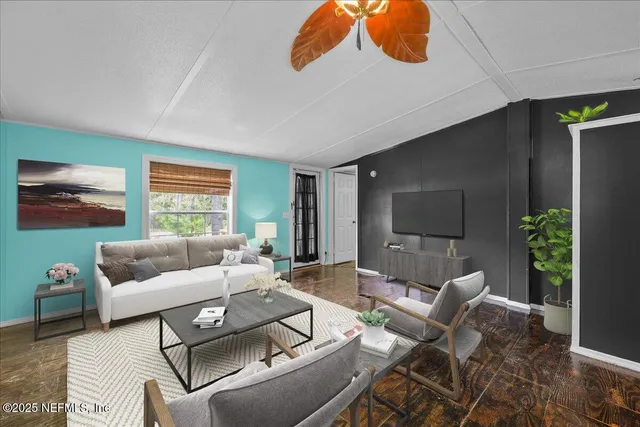 a living room with furniture and a flat screen tv