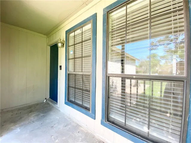 a view of a porch with a door