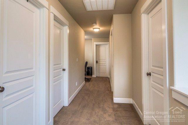 20378 Murphy Road Bend, OR 97702 - Photo 10 of 23 Extra wide upstairs hallway- each door l