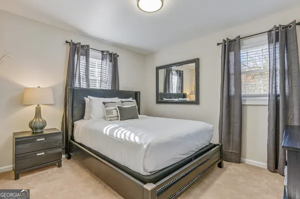 a bedroom with a bed and window