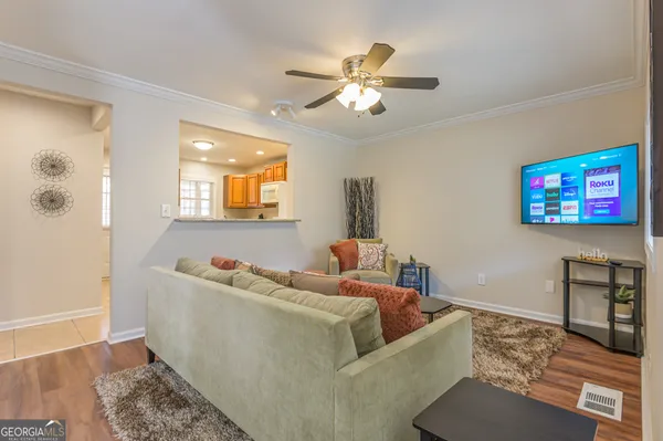 a living room with furniture and a flat screen tv