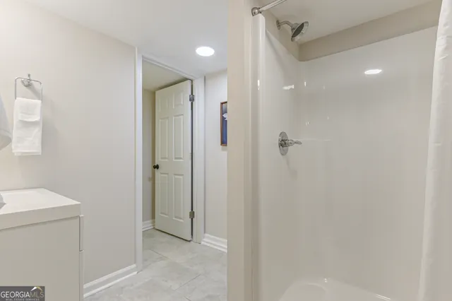 a bathroom with a shower and a toilet