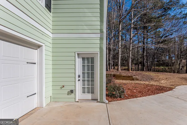 a view of a house with a tree