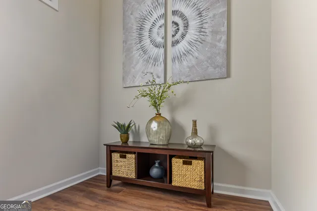 a table with a vase and flowers on it