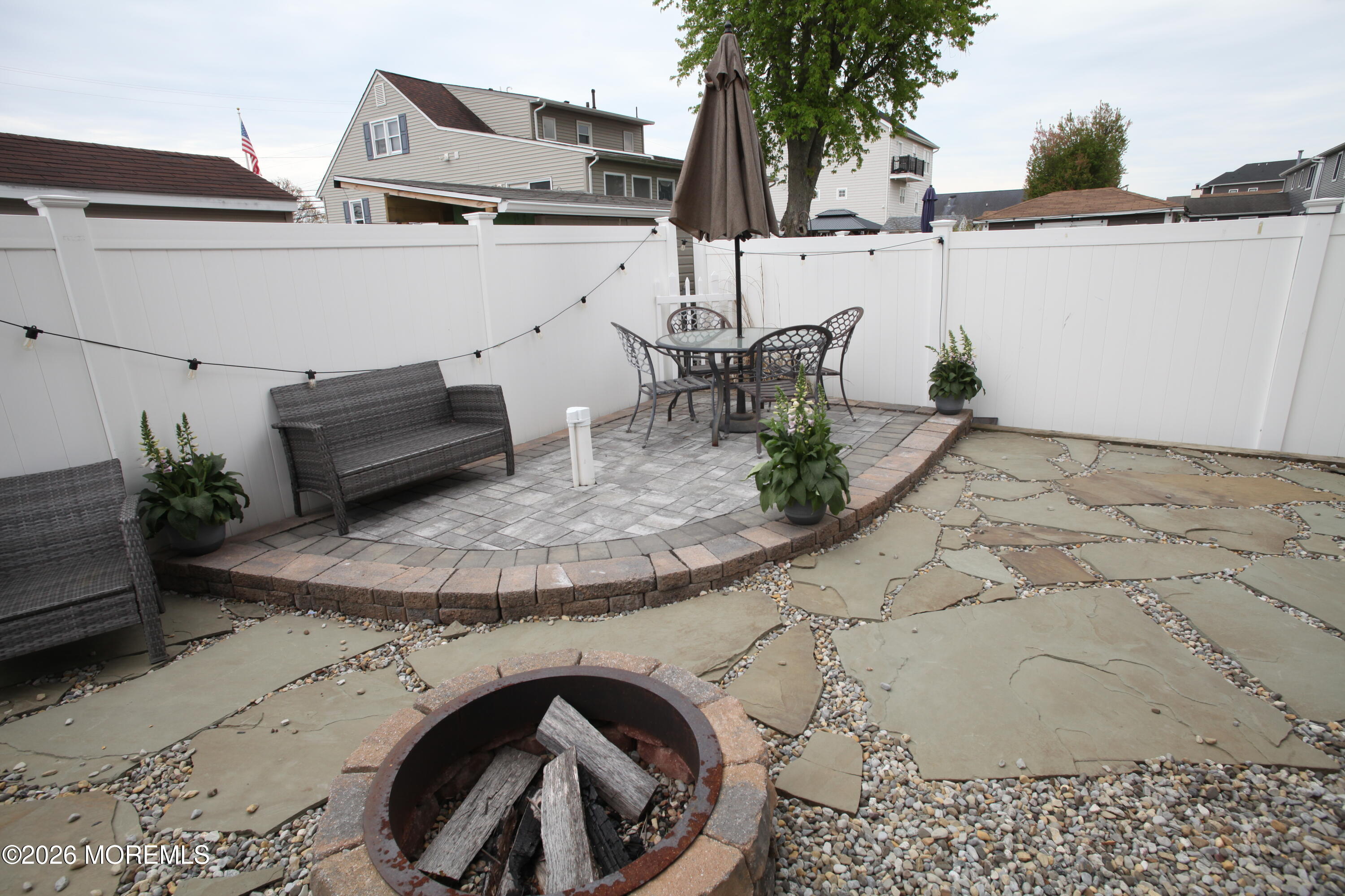 107 Waldron Road Toms River, NJ 08753 - Photo 14 of 20 a backyard of a house with table and chairs