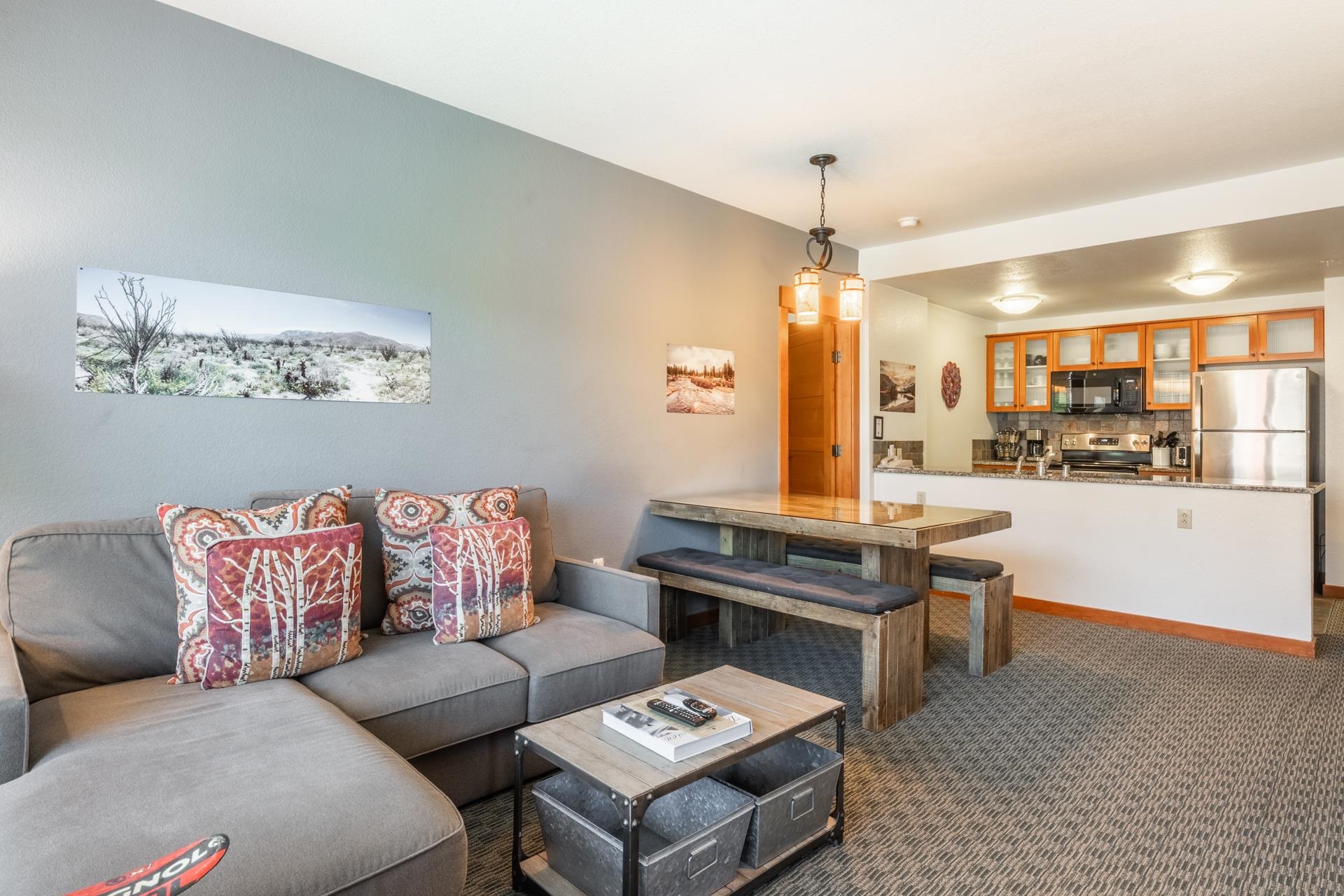 6201 Minaret Road, Unit 2312 Mammoth Lakes, CA 93546 - Photo 6 of 41 a living room with furniture and a chandelier