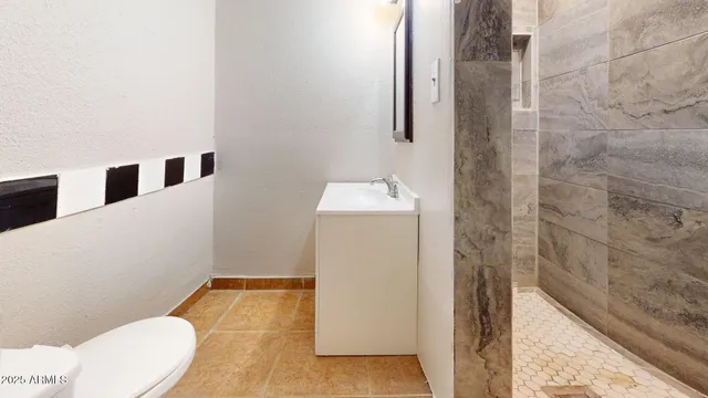 a bathroom with a sink and toilet