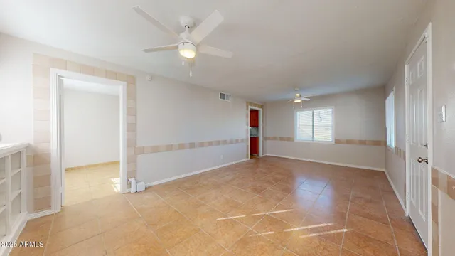 a view of an empty room and window