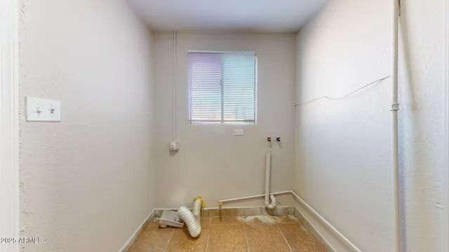 a bathroom with a sink and a window