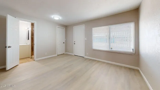 a view of an empty room with a window