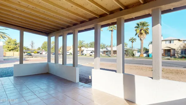 a lobby with furniture and large windows