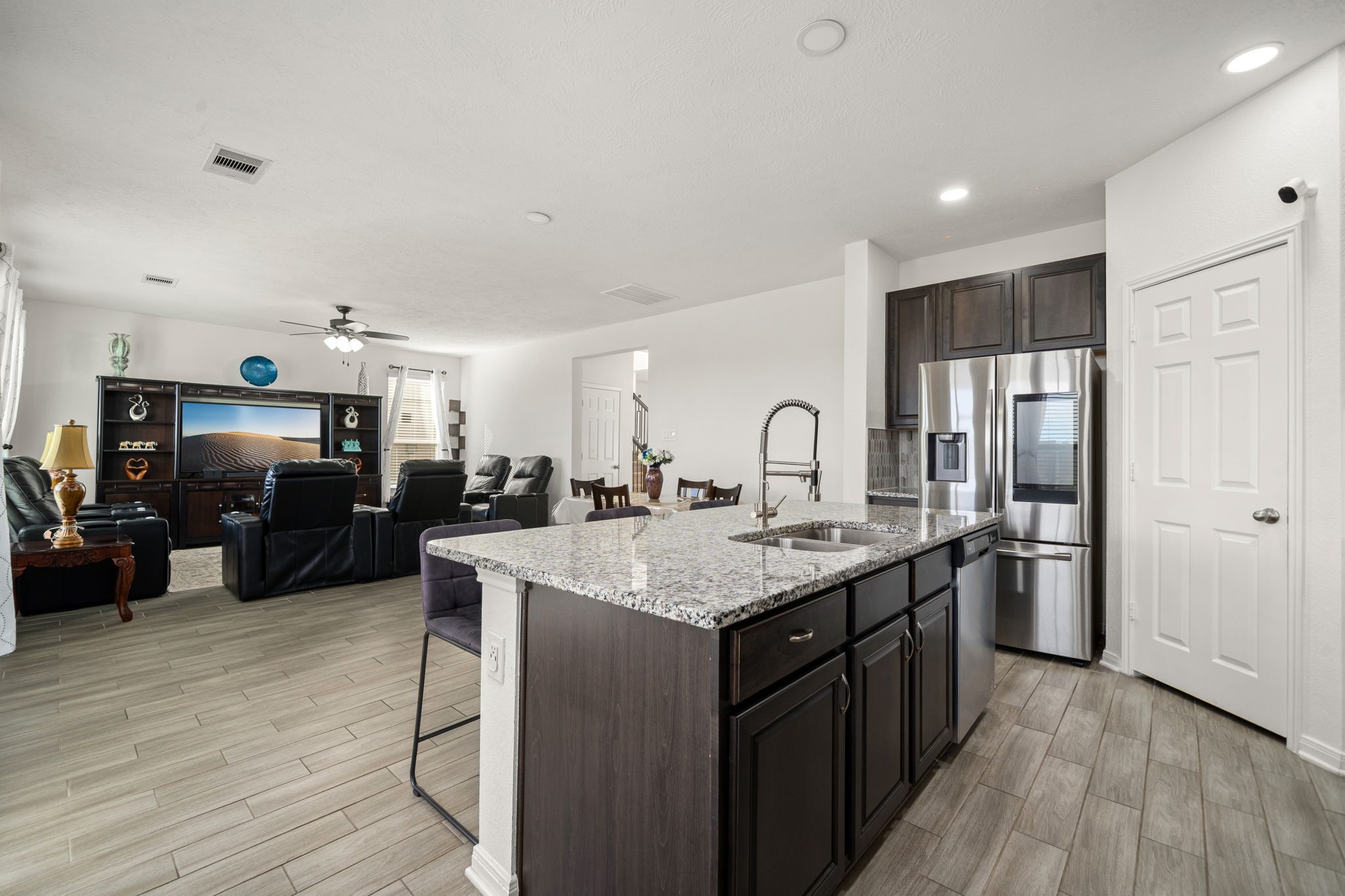 20811 Filbert Lane Katy, TX 77449 - Photo 13 of 43 a kitchen with stainless steel appliances granite countertop a sink stove and refrigerator