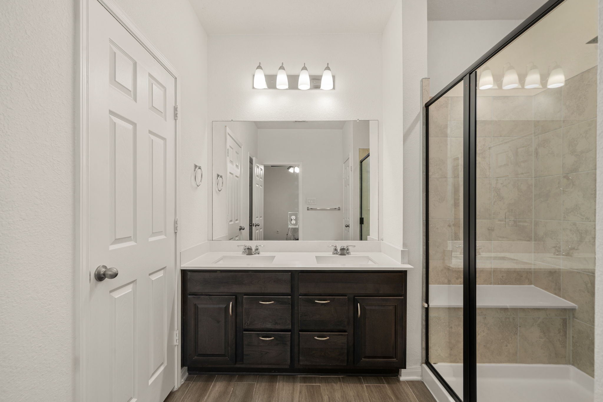 20811 Filbert Lane Katy, TX 77449 - Photo 17 of 43 a bathroom with a double vanity sink and a mirror