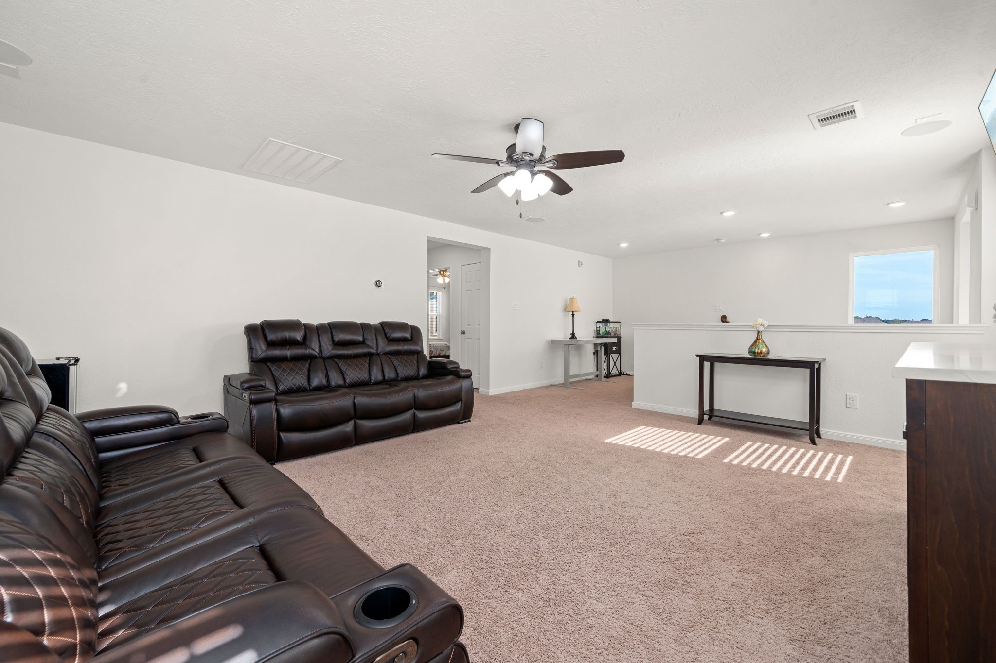 20811 Filbert Lane Katy, TX 77449 - Photo 20 of 43 a living room with furniture a ceiling fan and a rug