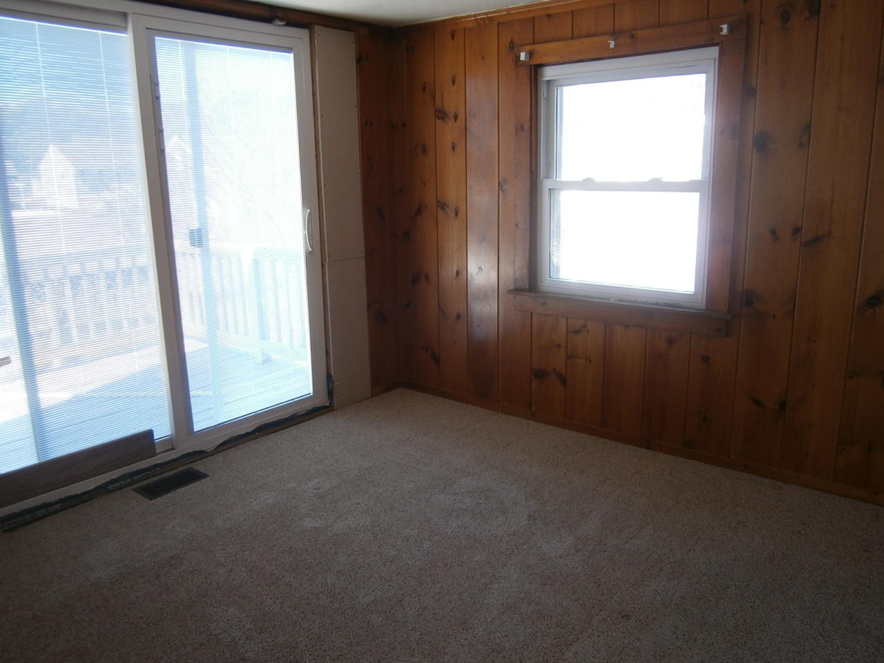 207 Captain Chase Road Dennis Port, MA 02639 - Photo 4 of 12 a view of an empty room with a window