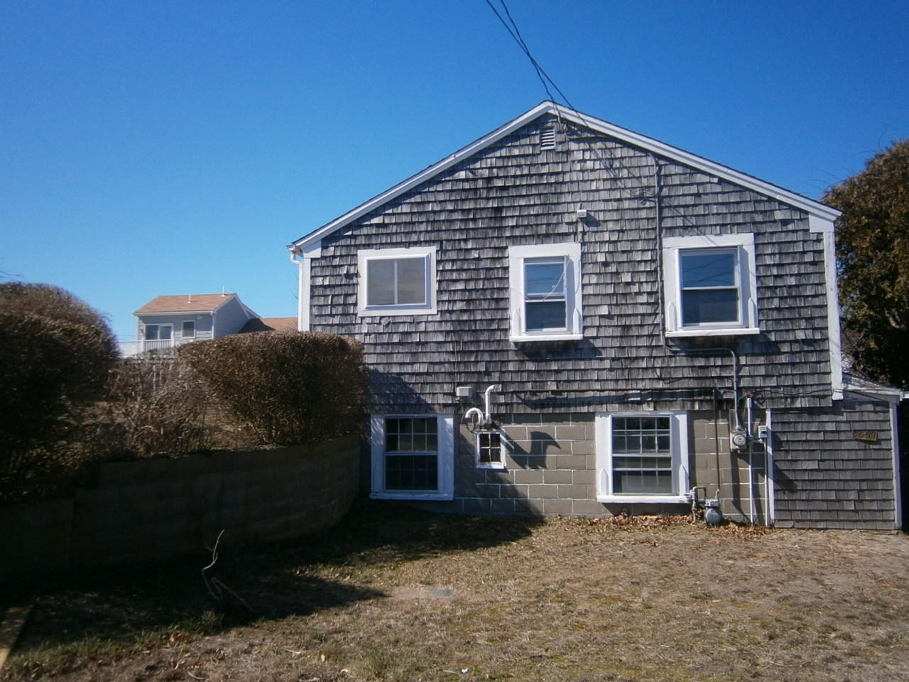 207 Captain Chase Road Dennis Port, MA 02639 - Photo 9 of 12 a front view of a house with yard