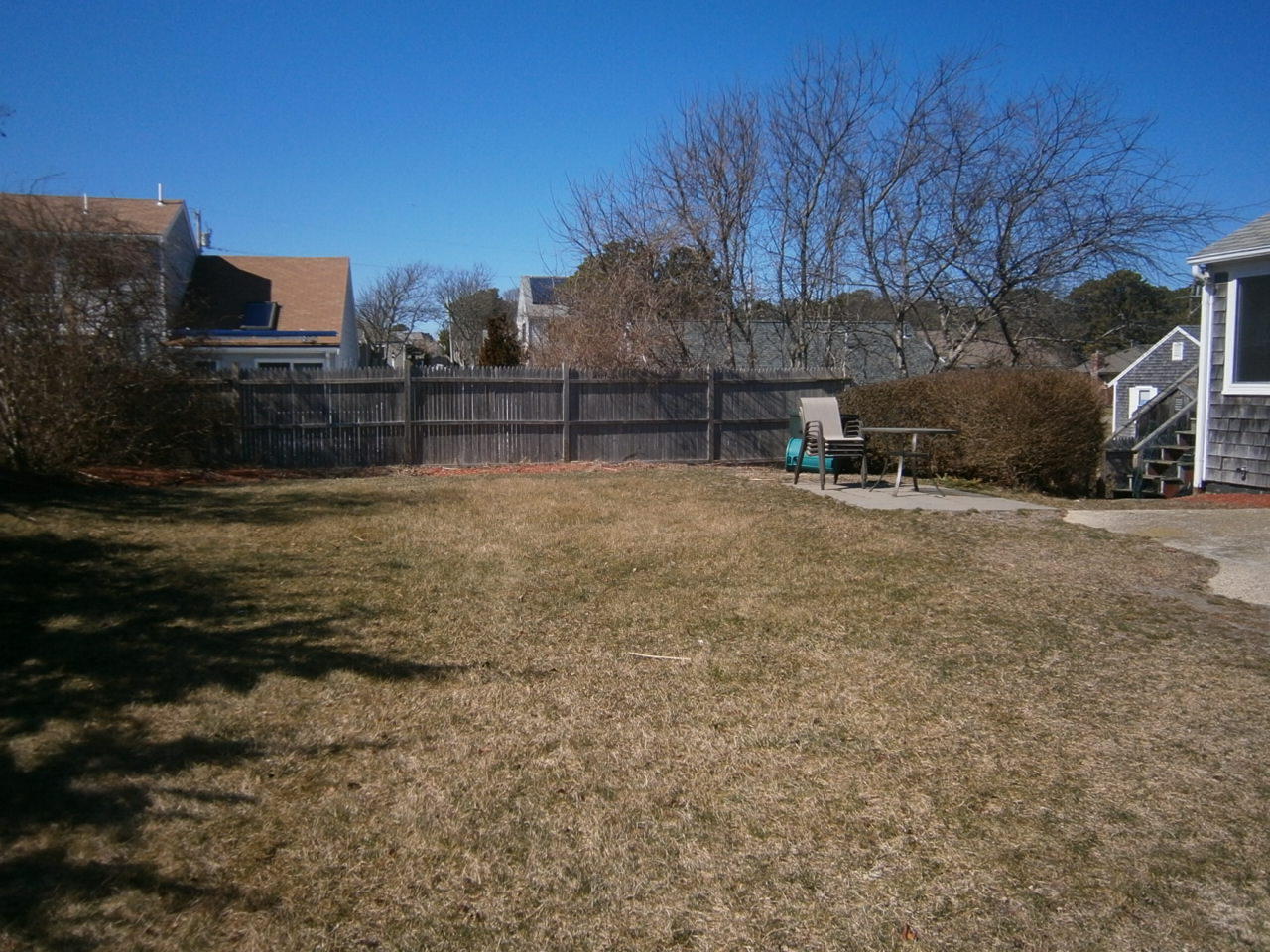 207 Captain Chase Road Dennis Port, MA 02639 - Photo 10 of 12 a view of backyard with large trees