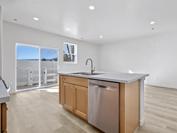 a spacious bathroom with a double vanity sink and a mirror