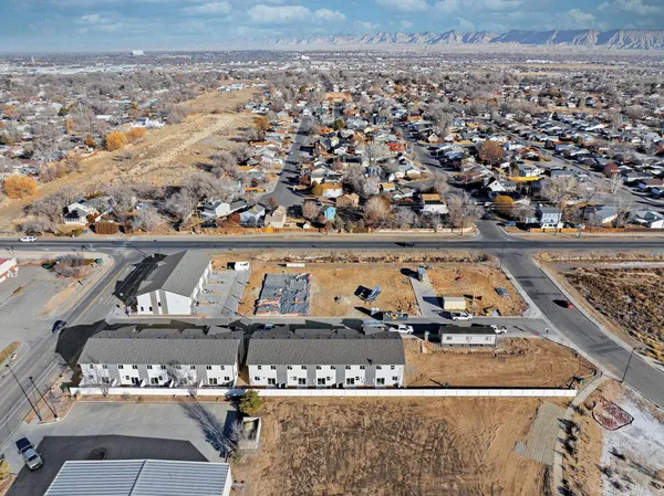 an aerial view of a rooftop view with seating space