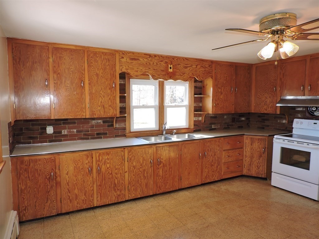 9 Park Road Webster, MA 01570 - Photo 10 of 41 a kitchen with granite countertop a sink cabinets and window