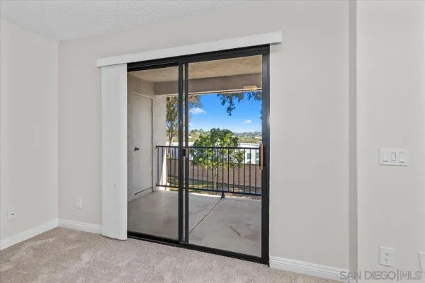 a view of a glass door and a window