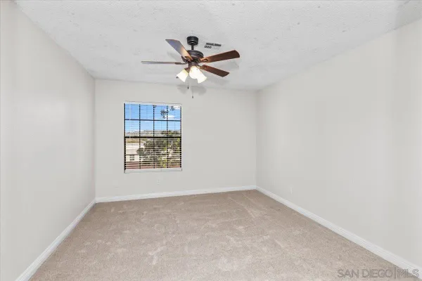 a view of a big room with carpet