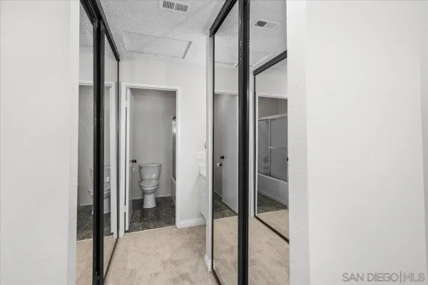 a view of a bathroom from a hallway