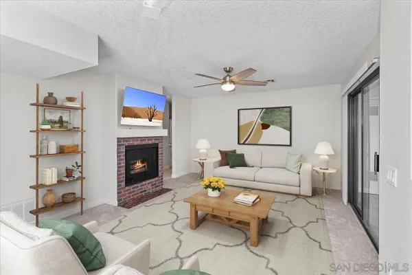 a living room with furniture and a fireplace