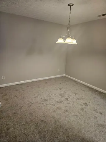 a view of a chandelier fan in a room