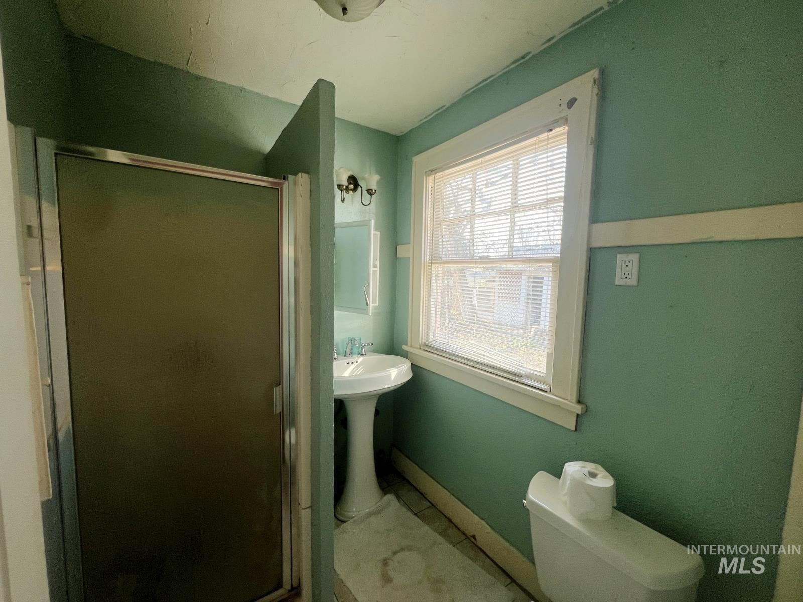 1002 9th Street Clarkston, WA 99403 - Photo 13 of 19 Bathroom with a shower stall and toilet